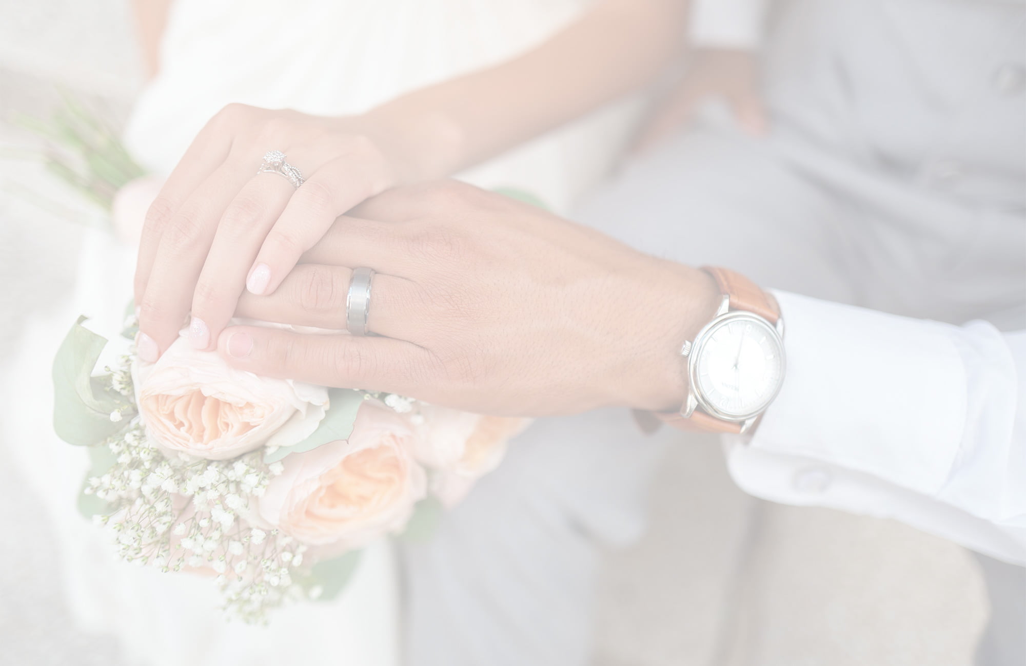 Holding hands showing wedding rings Flowers main